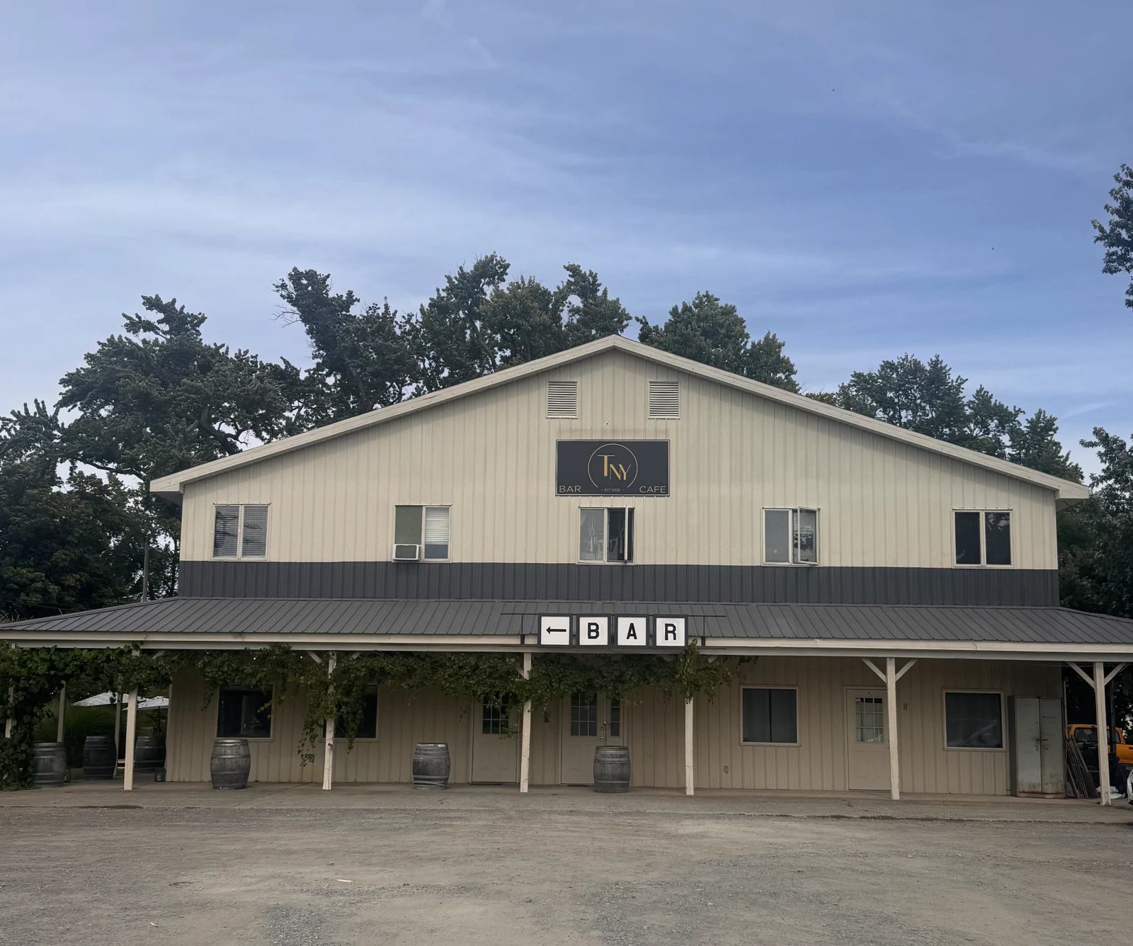 The Tousey NY building with its porch and wine barrels